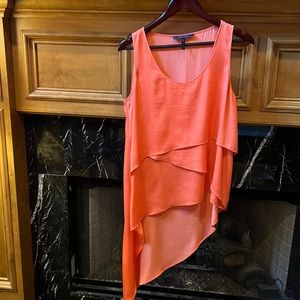 Bright coral/orange flowing tiered hi/lo top